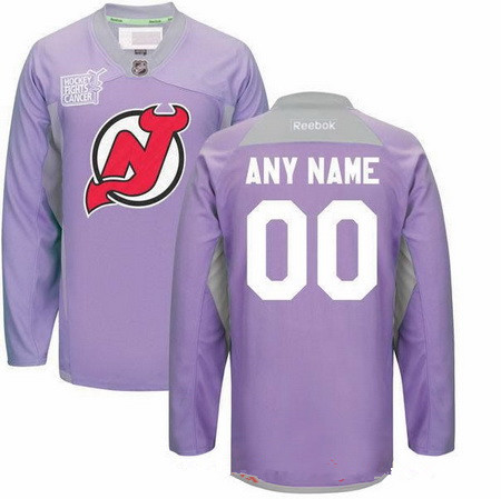 The New Jersey Devils wore purple Warm-up jerseys during Hockey Fights Cancer night before an NHL hockey game against the New York Islanders Friday, Nov. 23, 2018, in Newark, N.J. (AP Photo/Bill